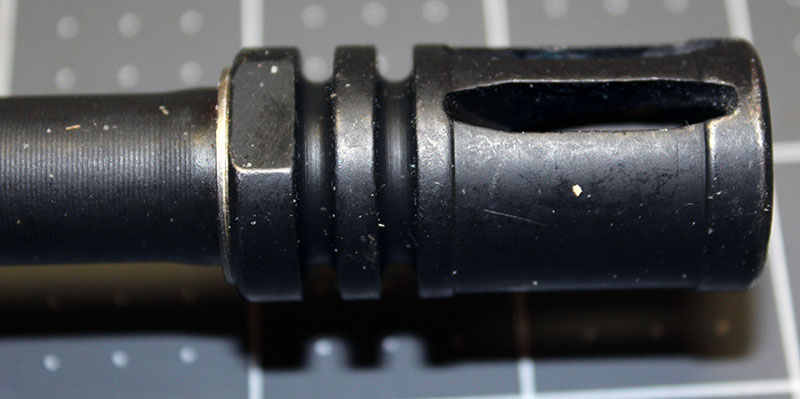 detail of the AR-15's muzzle device